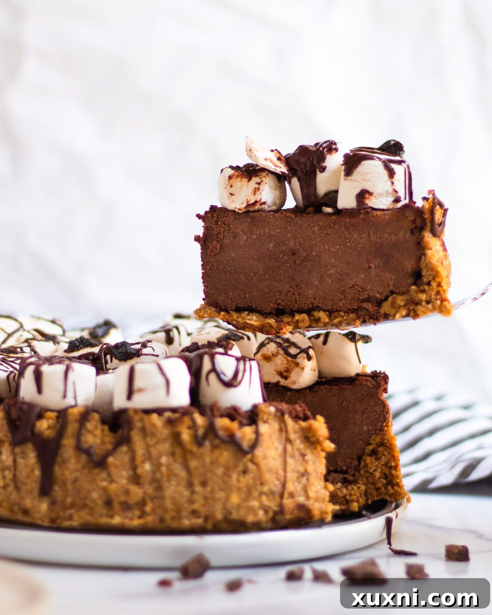 slice of chocolate pie being taken from cake