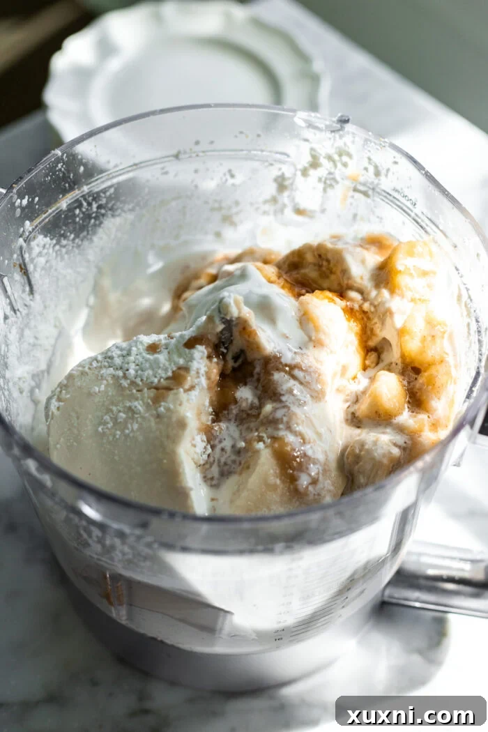cheesecake batter being blended in a food processor