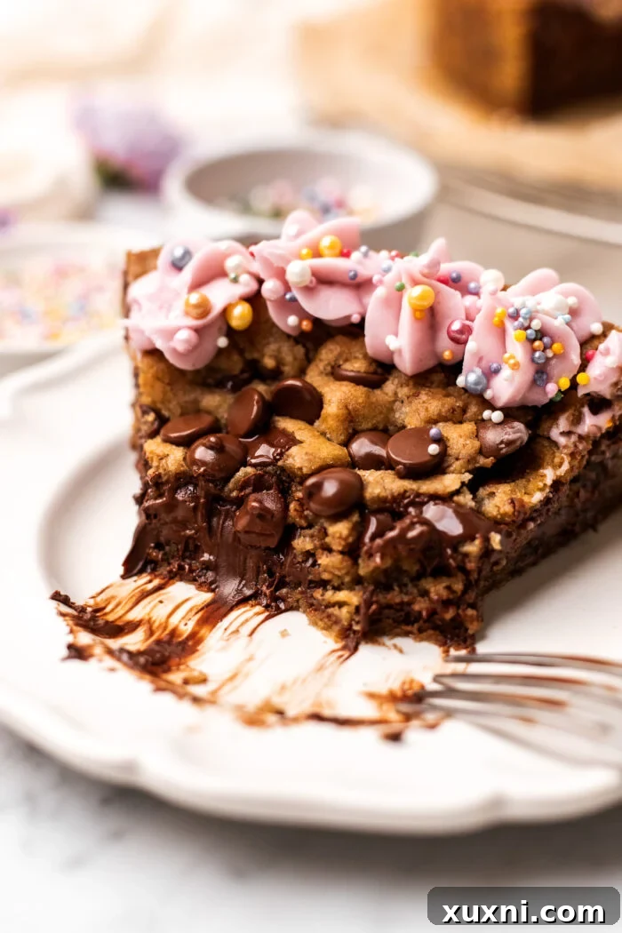 A single slice of vegan cookie cake without the Nutella center, showing its thick, chewy texture on a plate.