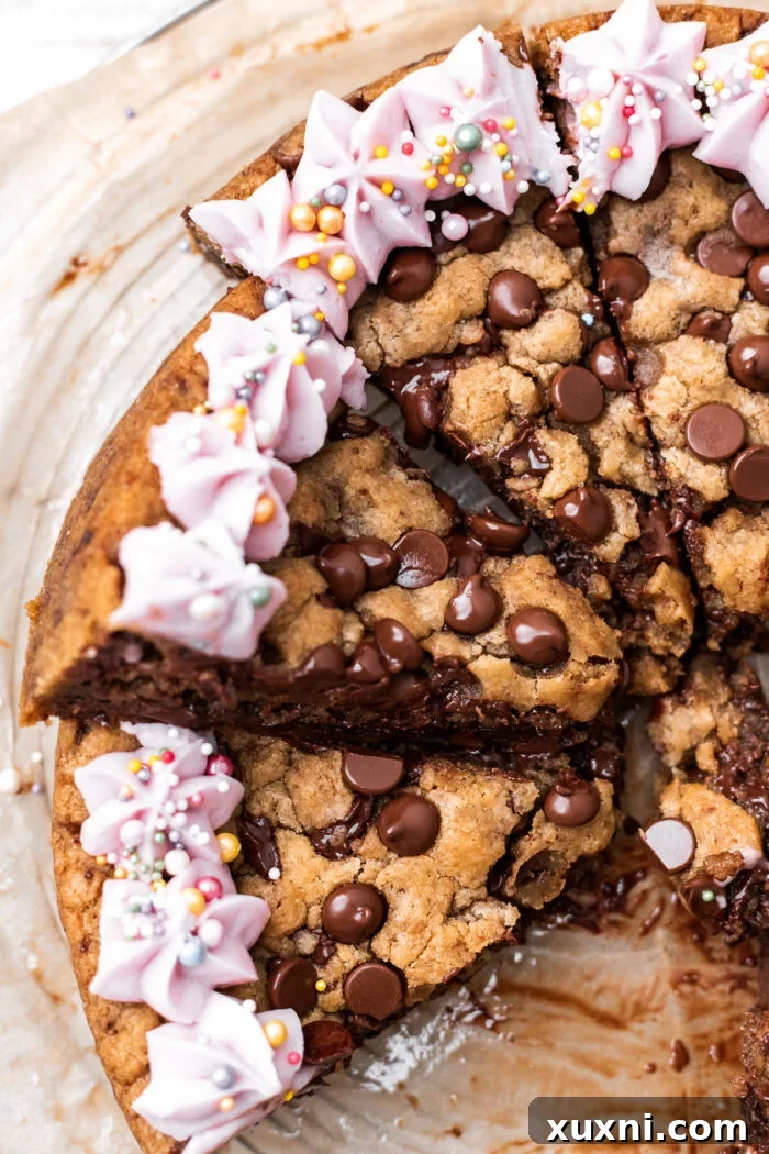 Close-up of multiple slices of vegan Nutella-stuffed cookie cake on a cutting board, highlighting the rich chocolate and hazelnut filling.