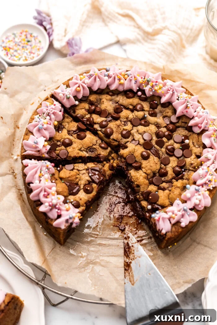Image showing a beautifully sliced vegan Nutella cookie cake, ready to be served.