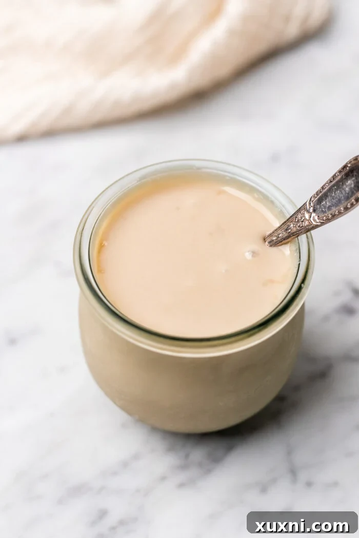 jar of cooled vegan sweetened condensed milk