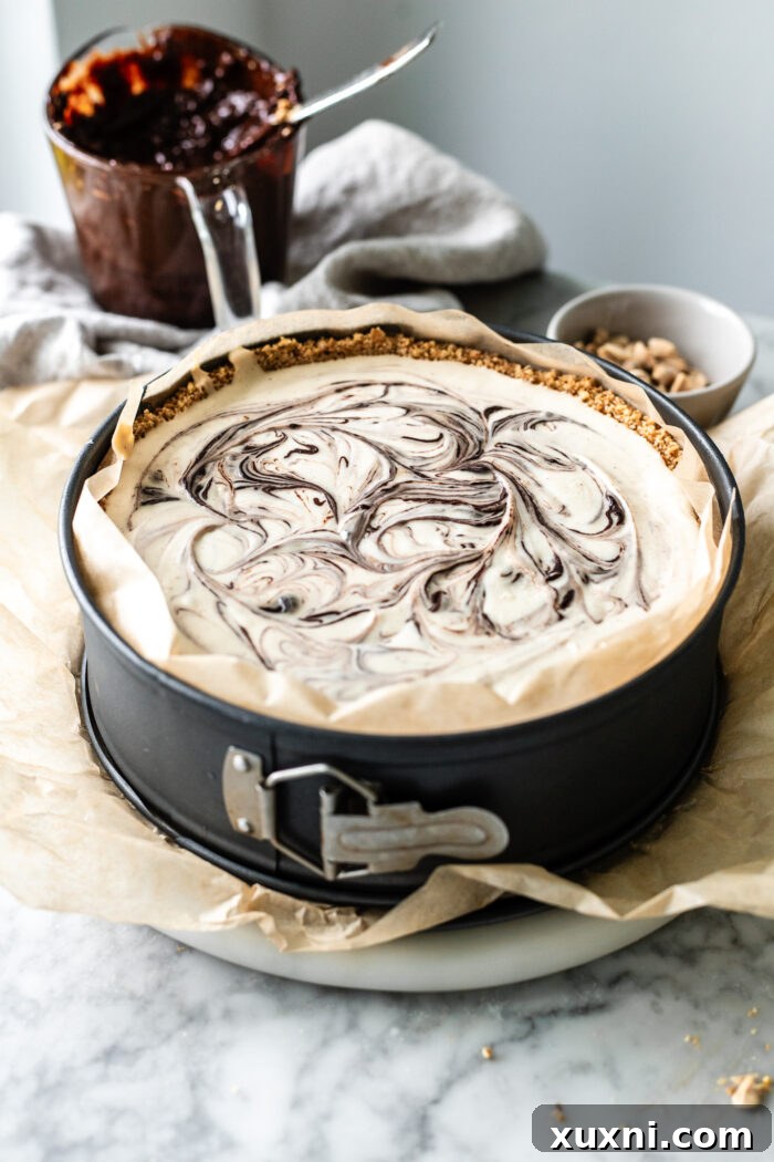 The perfectly frozen choco taco cheesecake removed from the pan, sitting at room temperature before being topped and served.