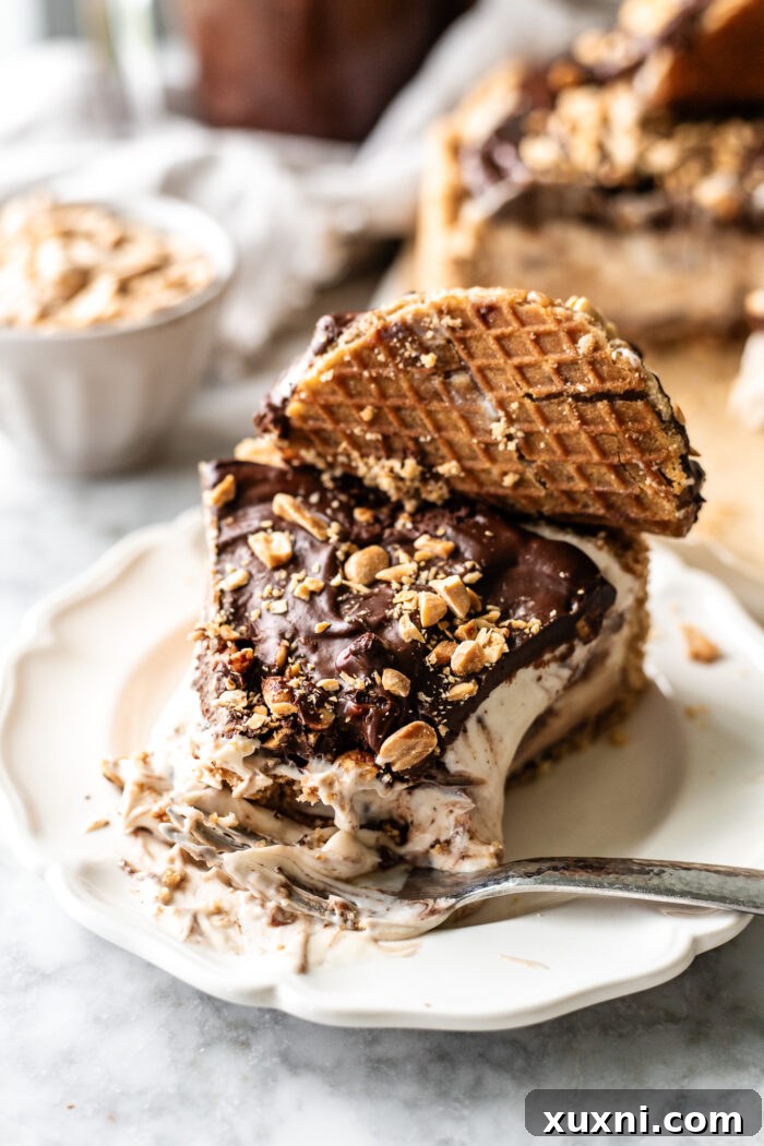 Close-up of a bitten slice of choco taco cheesecake, showing the creamy filling, fudge ripple, and crunchy crust.