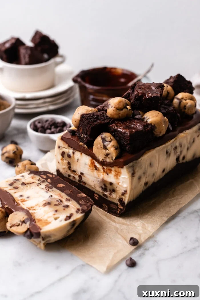 Plant-Powered Brookie Basque Cheesecake Bars for Small Cravings 3 Close-up of a perfectly sliced small batch vegan brookie cheesecake bar, showcasing its distinct layers of fudgy brownie, creamy cookie dough Basque cheesecake, and a tempting burnt top.