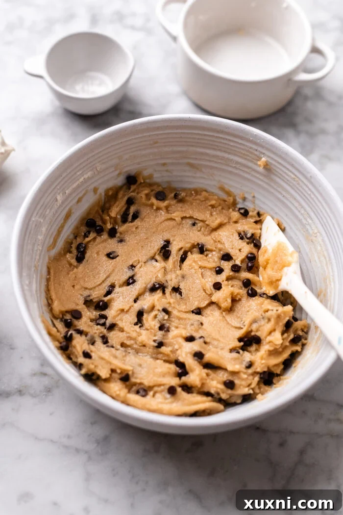 Plant-Powered Brookie Basque Cheesecake Bars for Small Cravings 4 Preparing creamy vegan cookie dough for the brookie basque cheesecake.