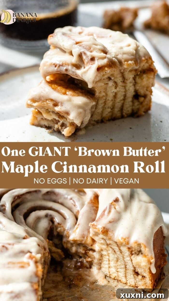 A Pinterest-optimized image featuring the giant vegan cinnamon roll cake, with text 'One GIANT Maple 'Brown Butter' Cinnamon Roll - No eggs, No Dairy!' Perfect for saving for later baking inspiration.
