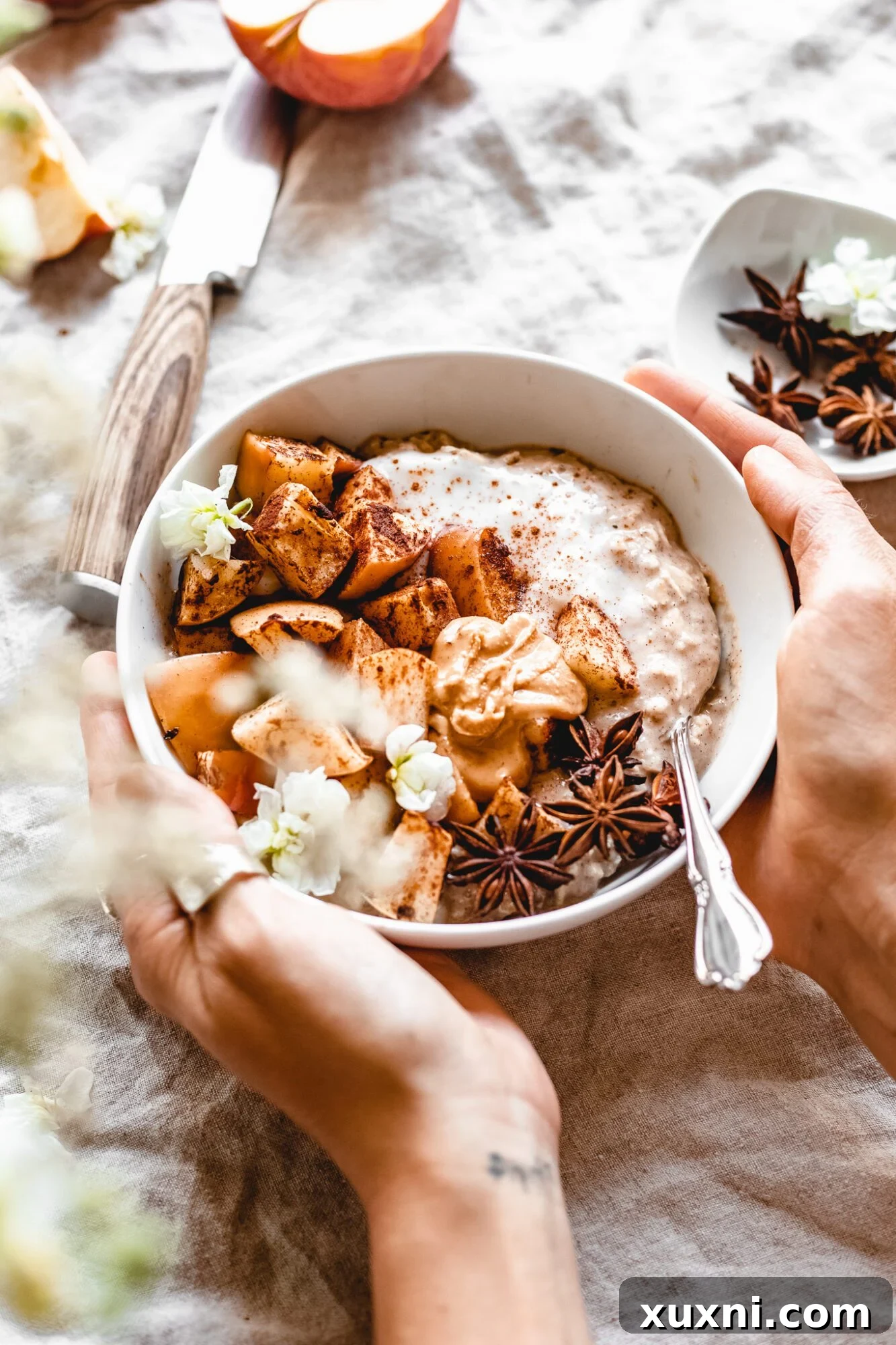 hands holding bowl of overnight oats