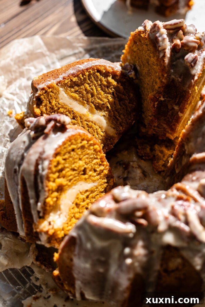 sliced pumpkin bundt cake showing the moist interior