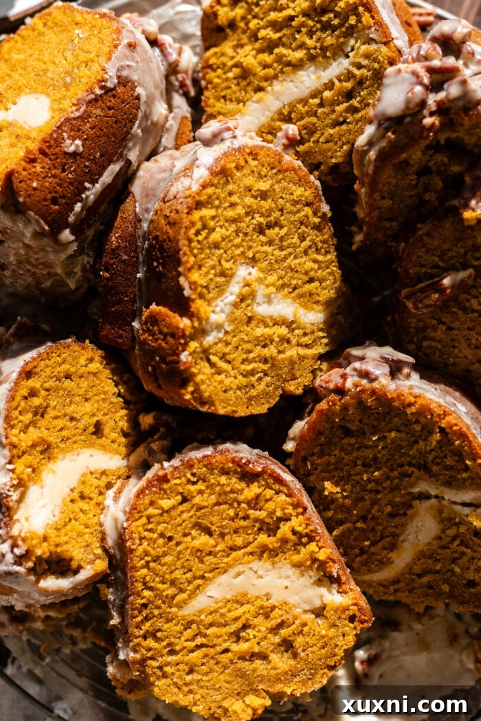 multiple slices of vegan pumpkin bundt cake on plates