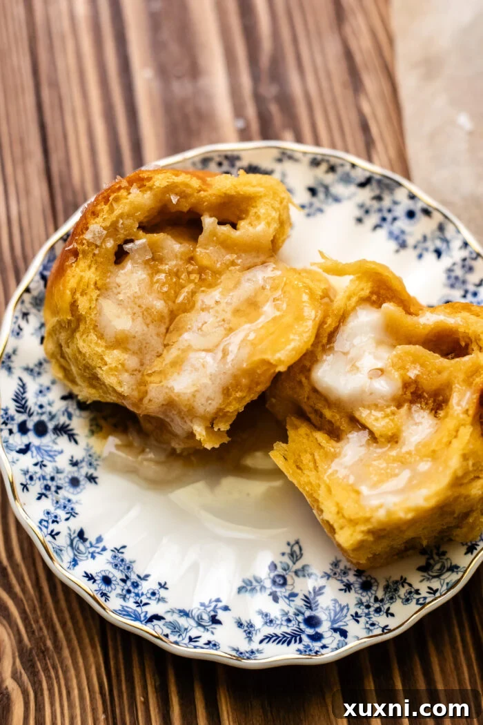 buttered vegan Parker house roll on a plate