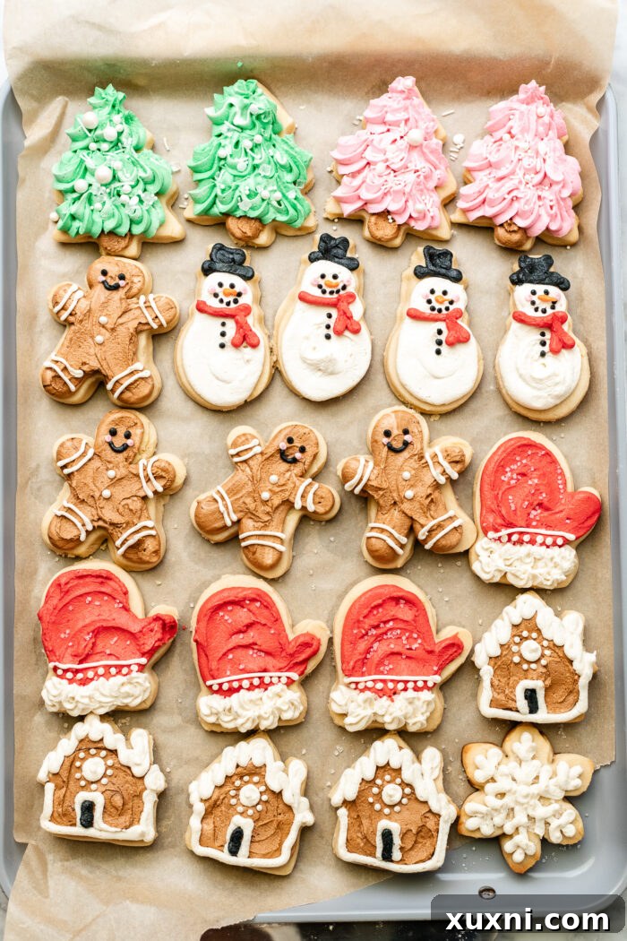 Soft Baked Frosted Dairy-Free Sugar Cookies with Vegan Cream Cheese Frosting 11 Array of decorated vegan sugar cookies, some with intricate piping