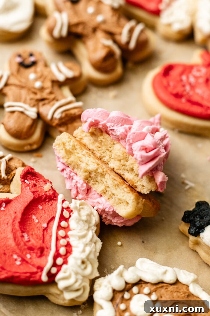 Soft Baked Frosted Dairy-Free Sugar Cookies with Vegan Cream Cheese Frosting 13 A perfectly frosted and bitten vegan cream cheese sugar cookie, showcasing its soft interior