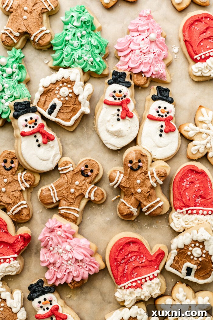 Soft Baked Frosted Dairy-Free Sugar Cookies with Vegan Cream Cheese Frosting 4 Assortment of decorated vegan cream cheese sugar cookies with various colors and sprinkles