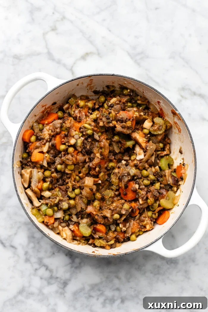 cooked vegetables simmering with tomato paste and spices