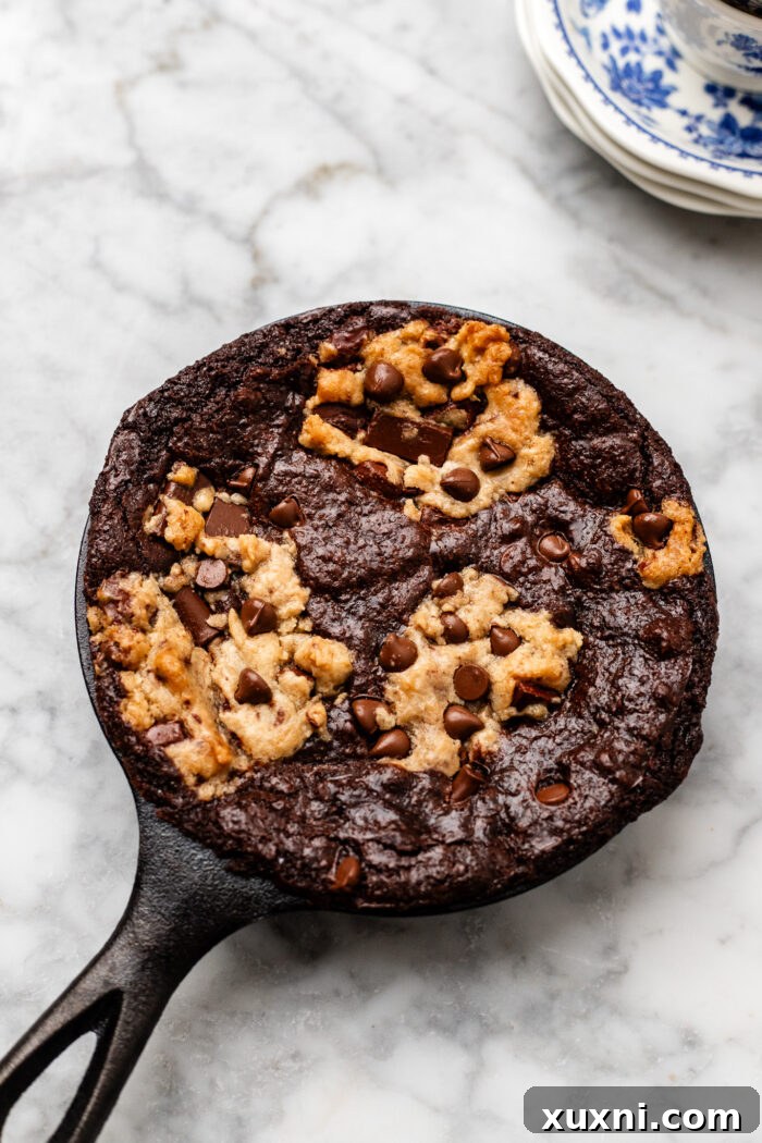 A freshly baked mini cookie skillet, golden brown and perfectly set, cooling slightly before serving.