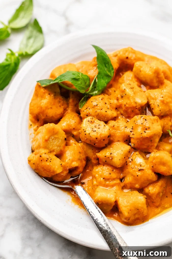 close up of roasted red pepper pasta in a bowl