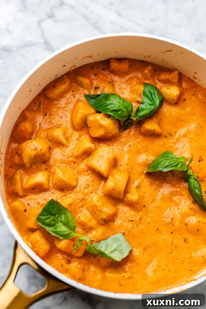 creamy roasted red pepper gnocchi with fresh herbs