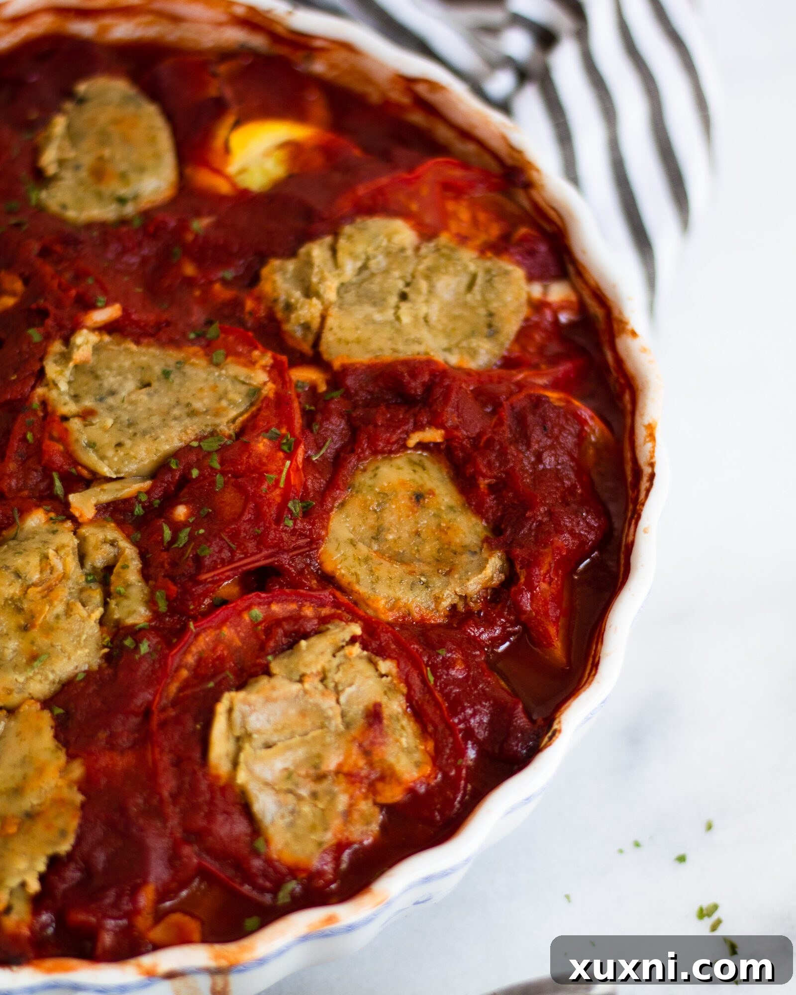 Close-up of baked ratatouille, showcasing the tender vegetables and rich tomato sauce