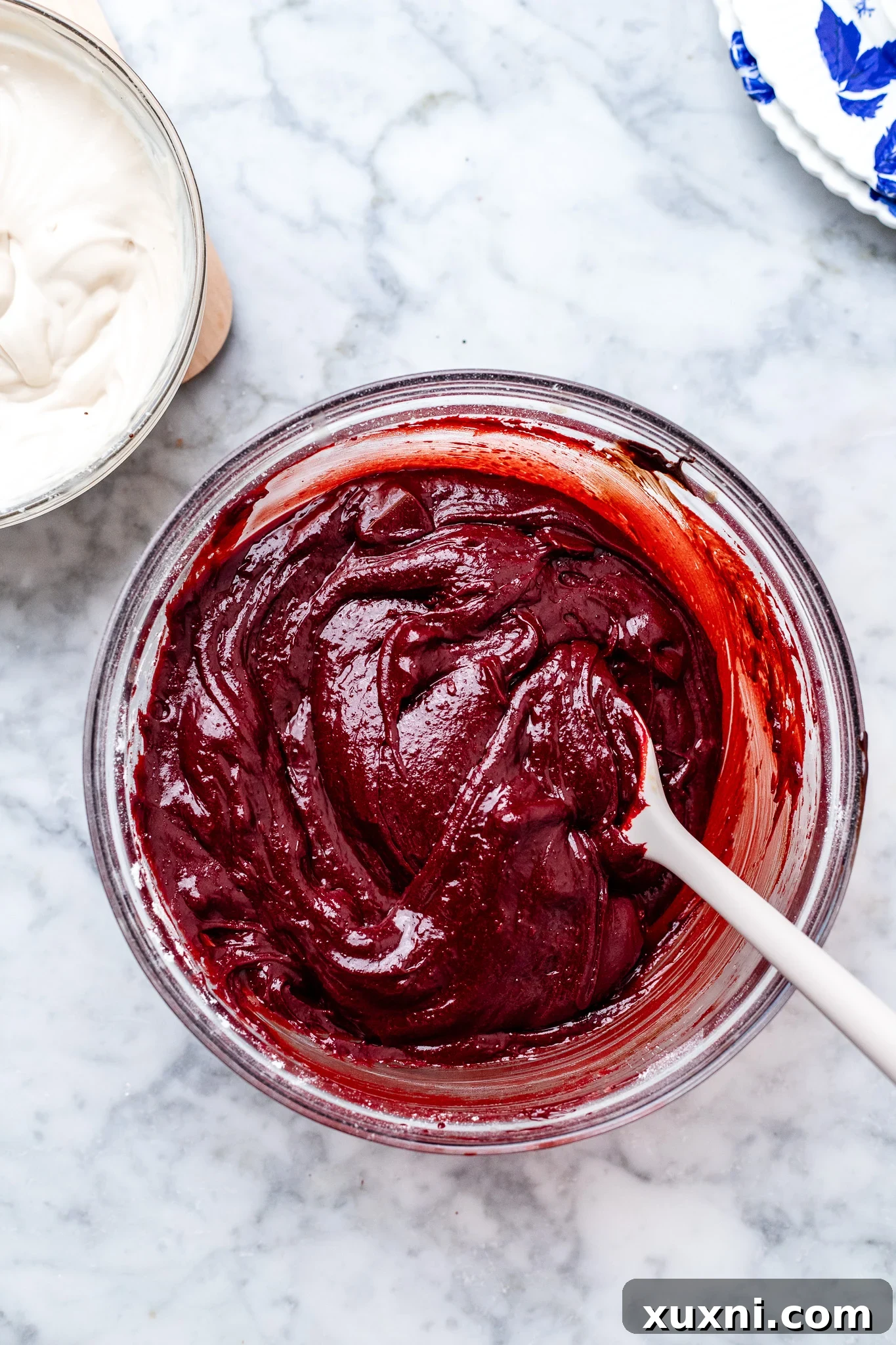 Smooth, rich red velvet brownie batter in a bowl.