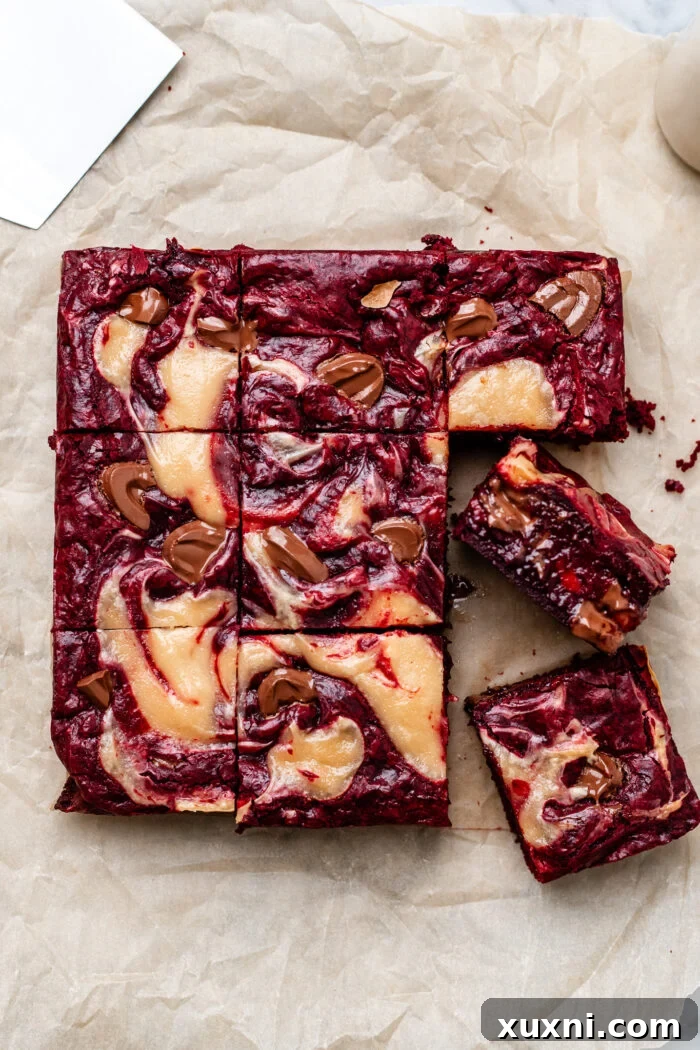 Freshly baked and sliced vegan red velvet brownies, showing their perfect texture.