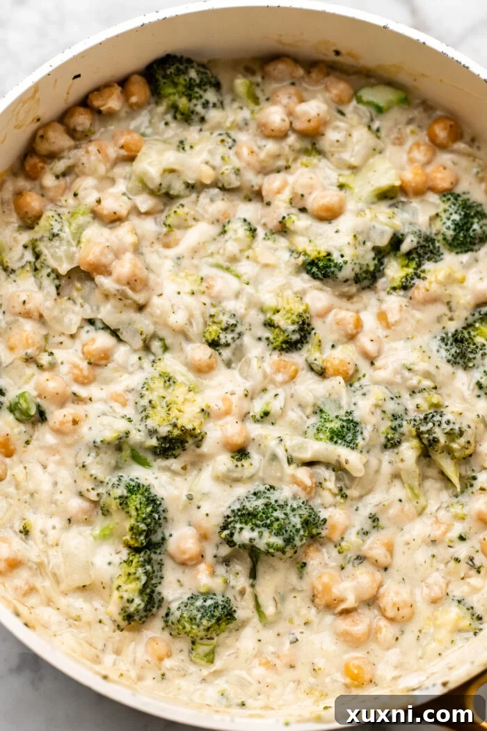 skillet of chickpea broccoli alfredo bake