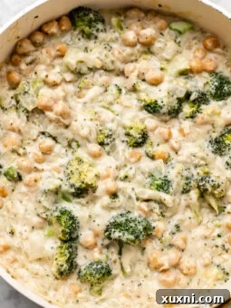 skillet of chickpea broccoli alfredo bake