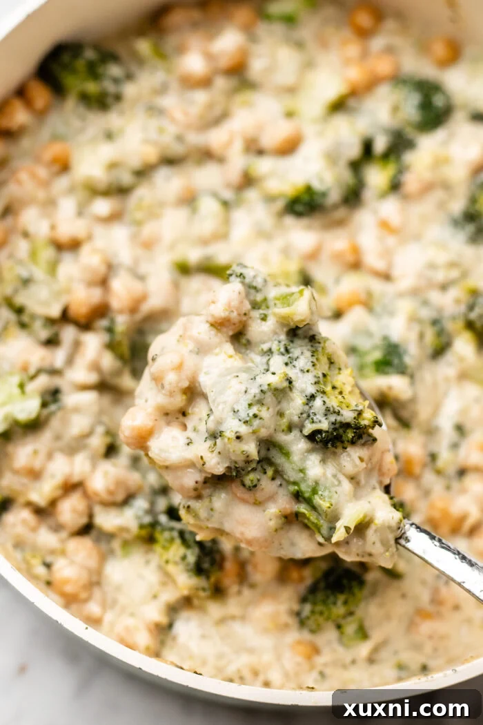 serving the chickpea broccoli alfredo skillet