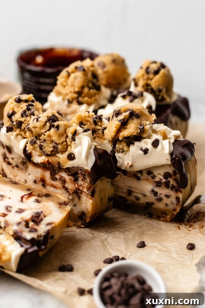 sliced small batch cookie dough cheesecake on parchment paper