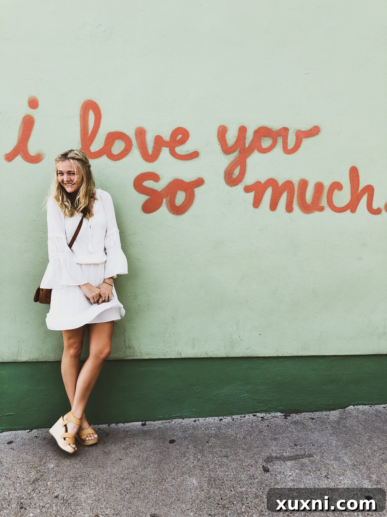 A candid photo of one of the food bloggers smiling and engaging in conversation, with a blurred background suggesting a lively setting.