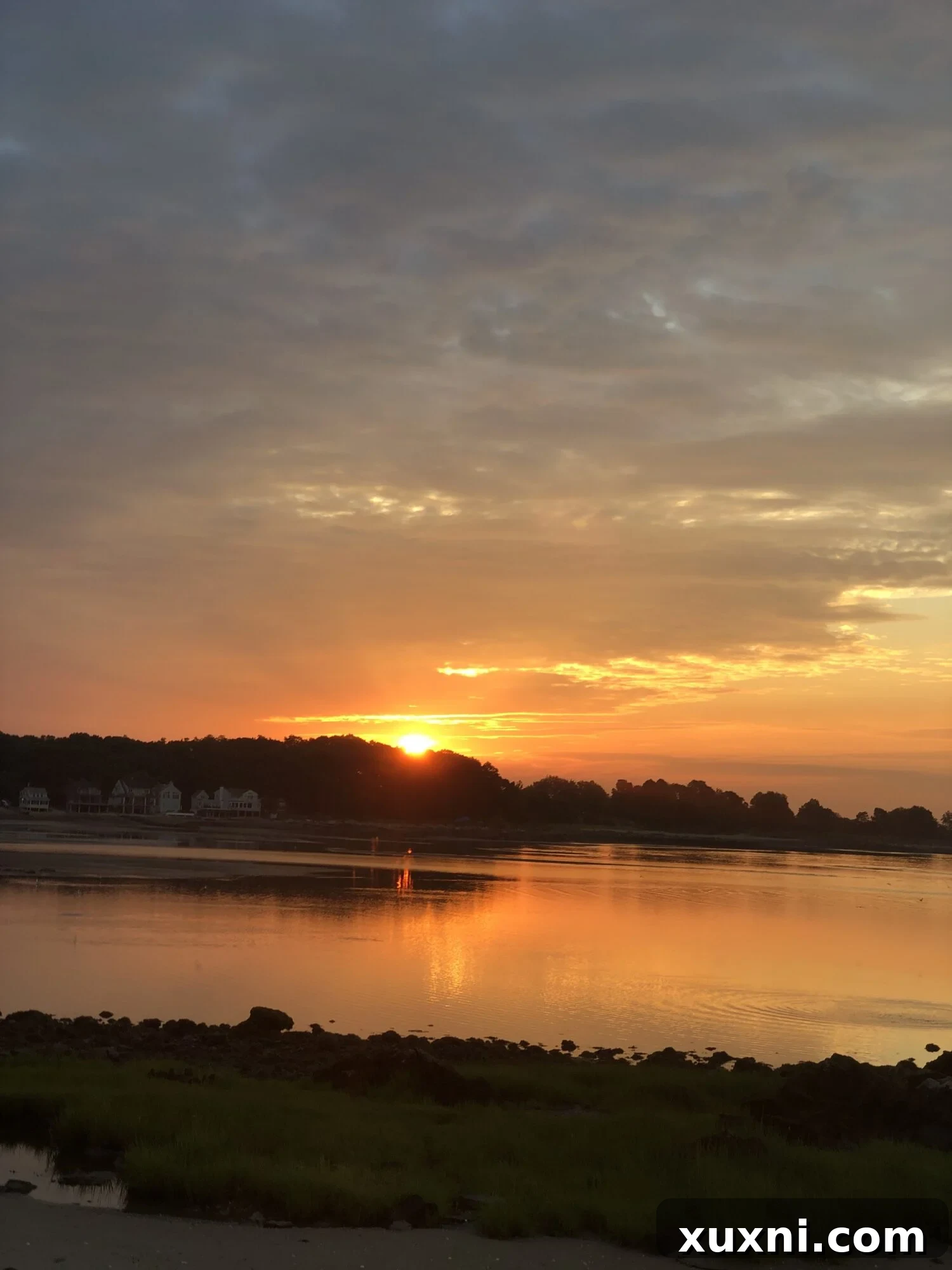 A stunning sunrise over the ocean, with warm light reflecting on the calm water.