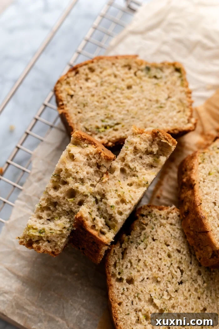Unbelievably Moist Vegan Zucchini Bread 4 broken open slices of zucchini bread