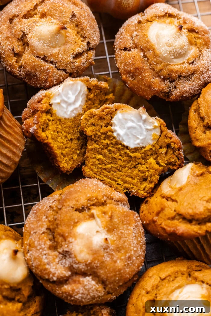sliced open vegan pumpkin muffins showing filling and texture