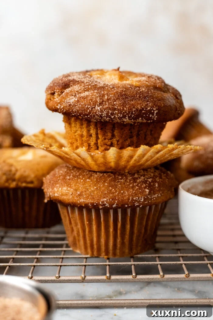 stacked vegan pumpkin muffins with cream cheese filling