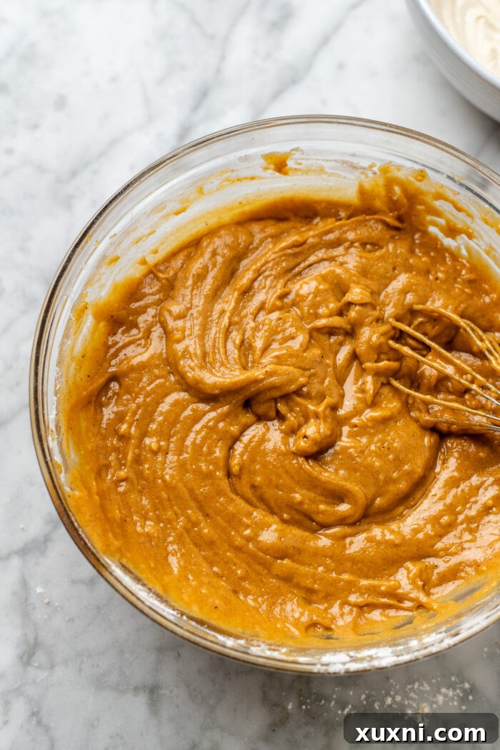 pumpkin muffin batter in a bowl