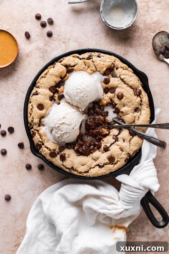 Fully baked vegan skillet cookie, ready to be served