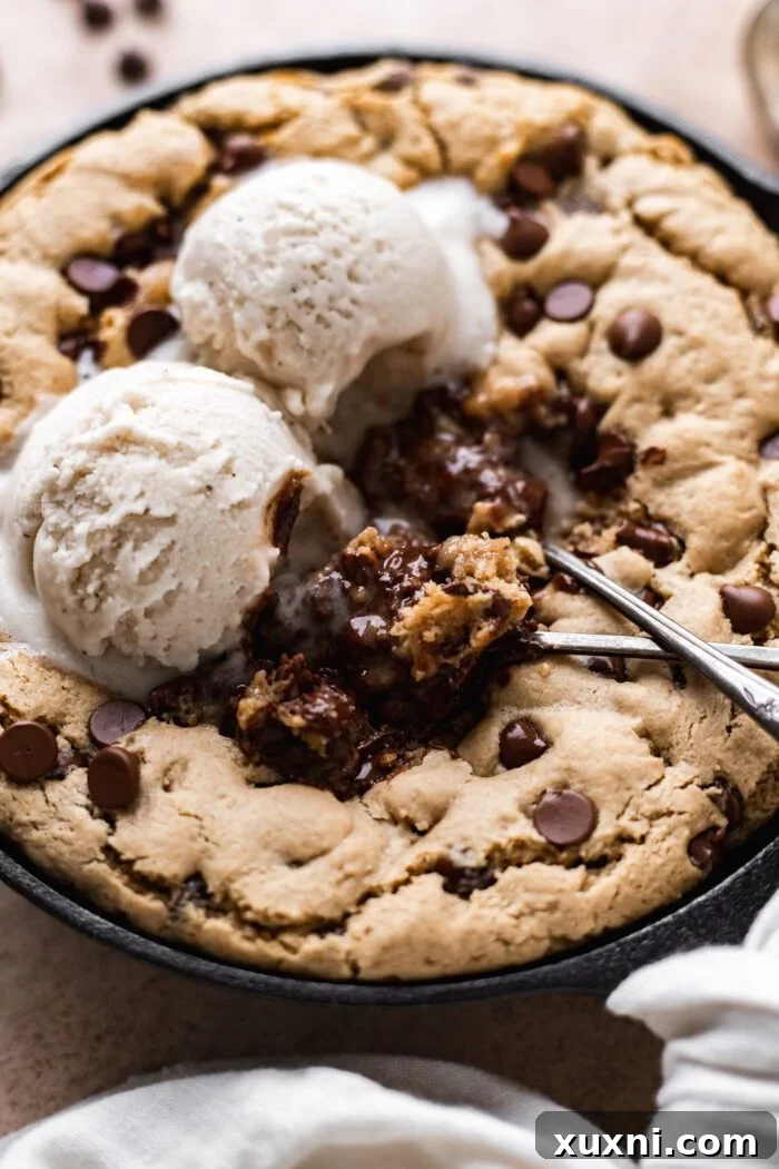 Close-up view of the rich, gooey texture of a vegan skillet cookie