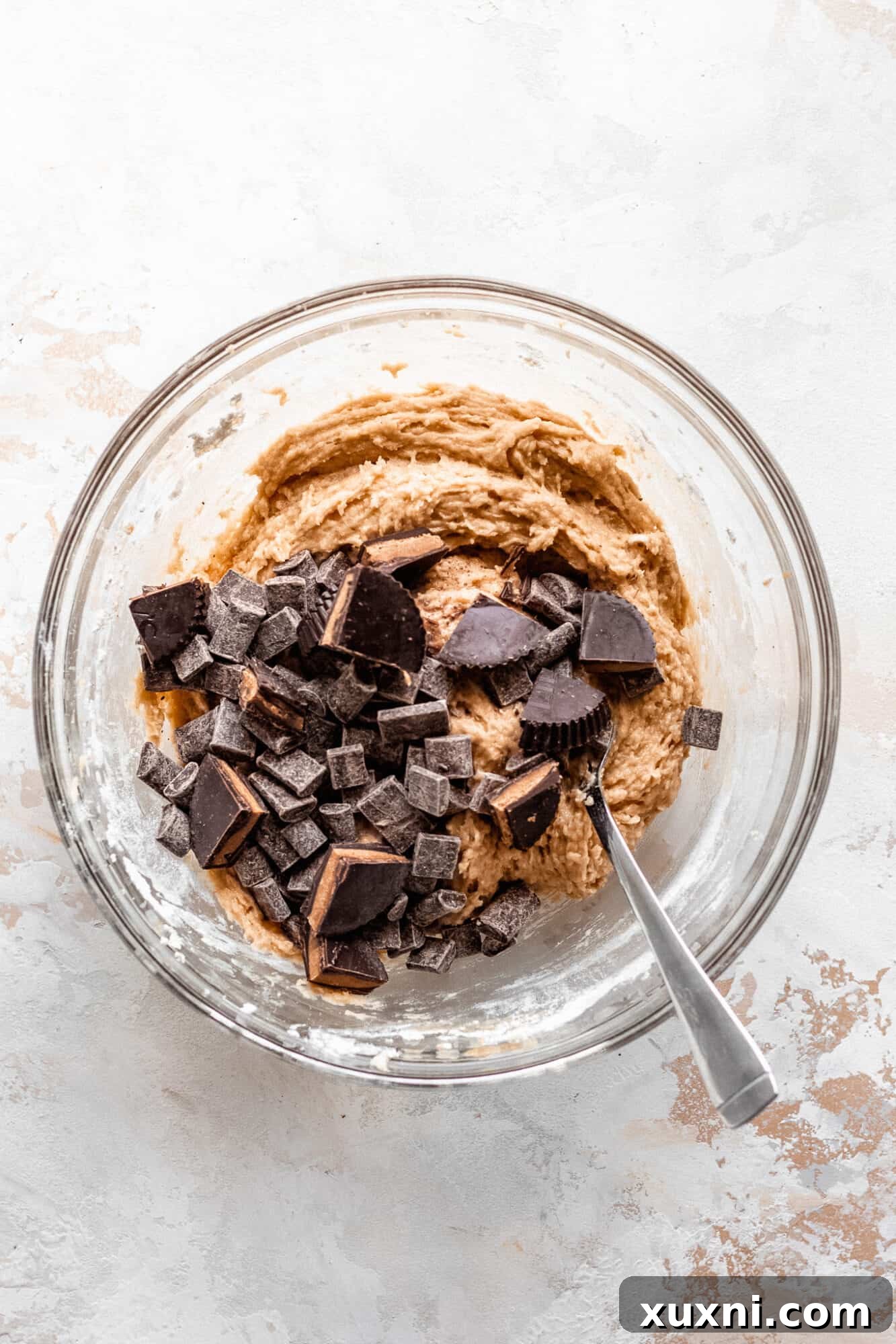 Peanut butter cookie batter with chocolate chips folded in