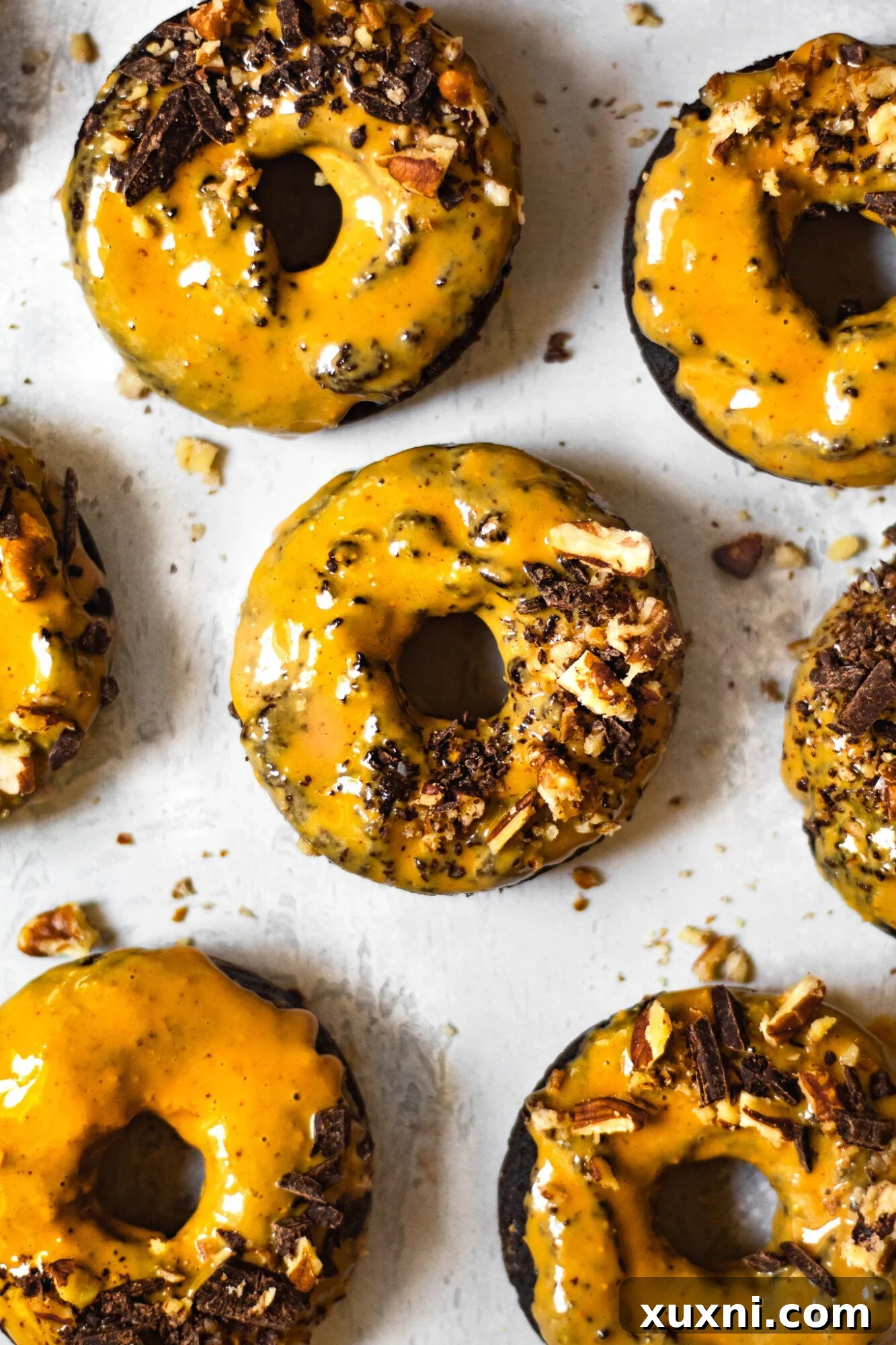 Peanut butter glazed healthy chocolate donuts on a cooling rack