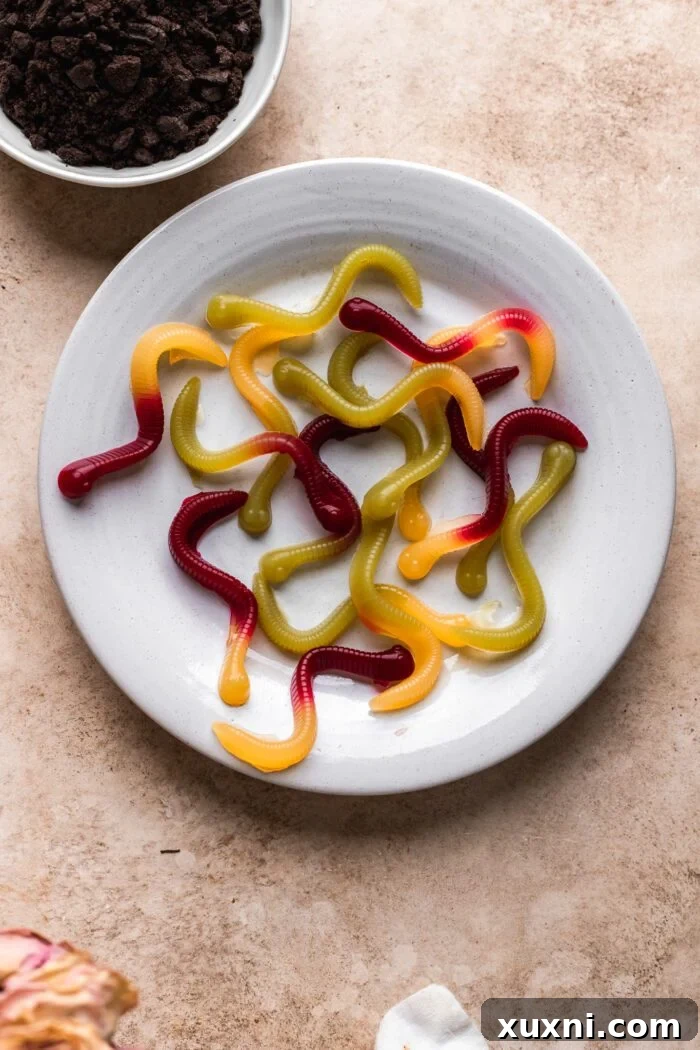 Assortment of homemade vegan gummy worms in various colors.