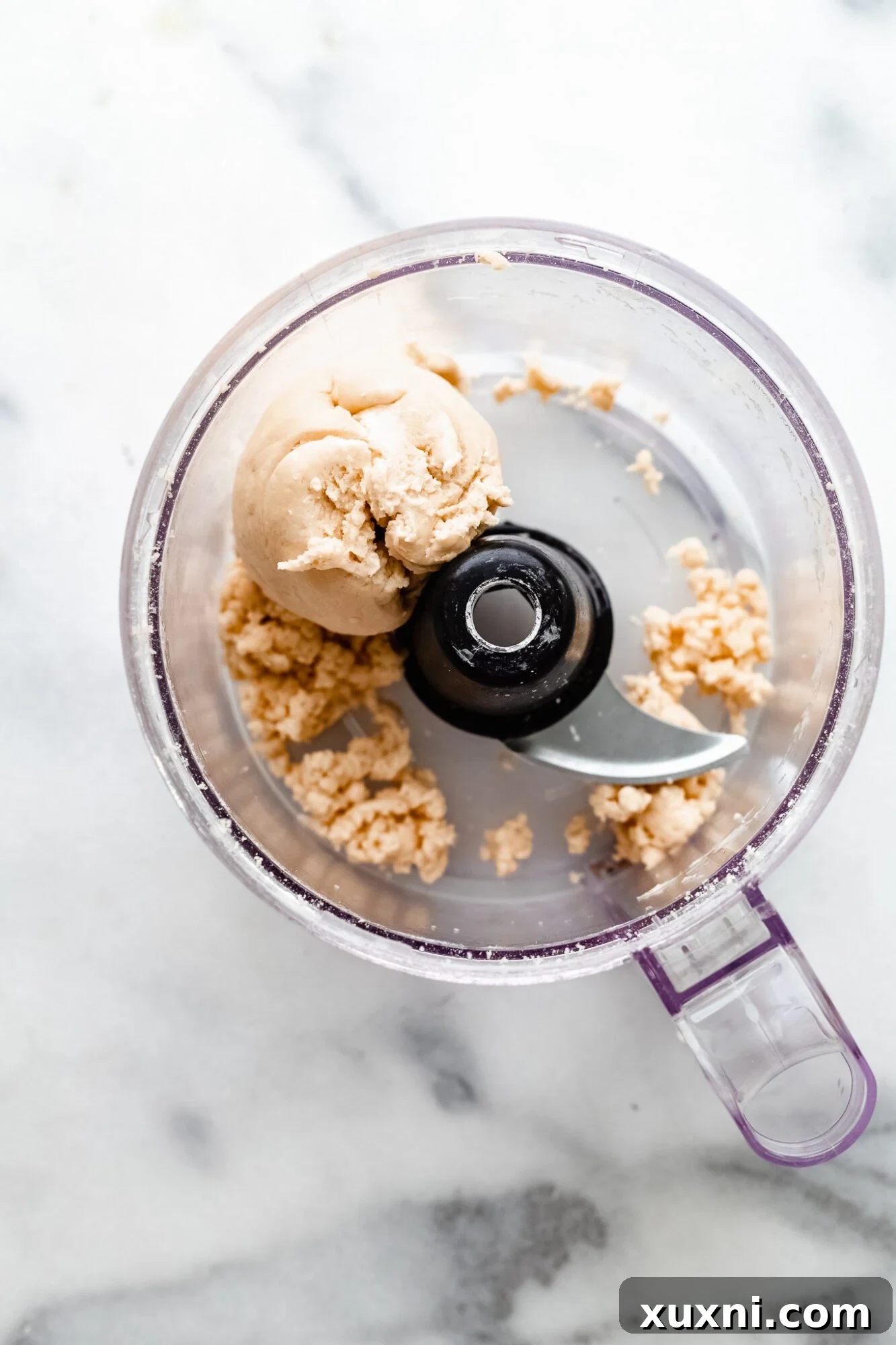 Easy Flaky Vegan Pie Crust The All-Vegan Butter Method 5 The process of making pie dough, specifically adding liquid to the food processor.