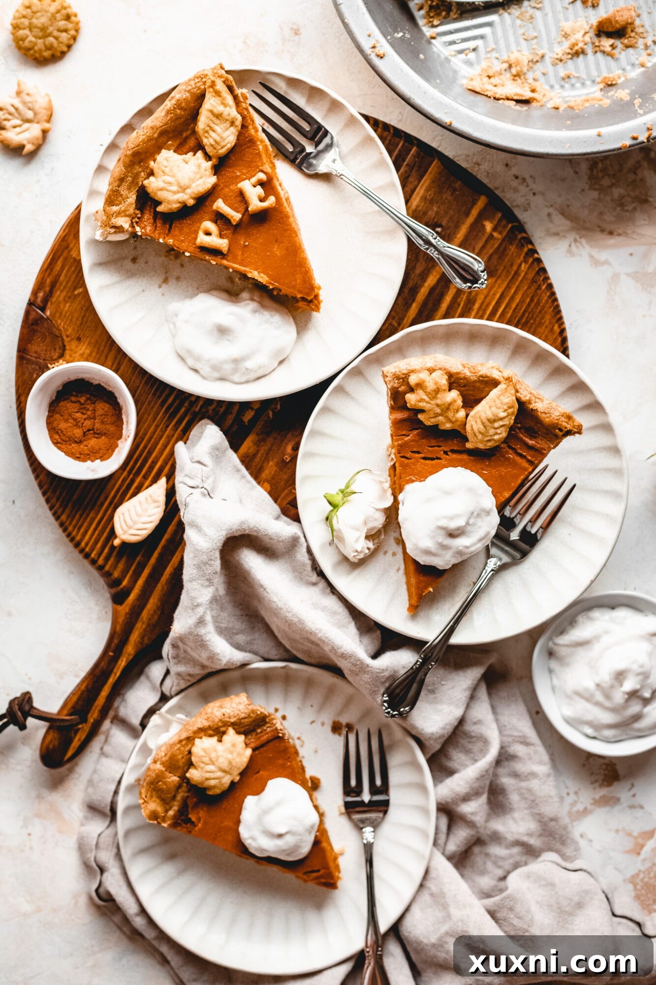 slices of sweet potato pie on white plates