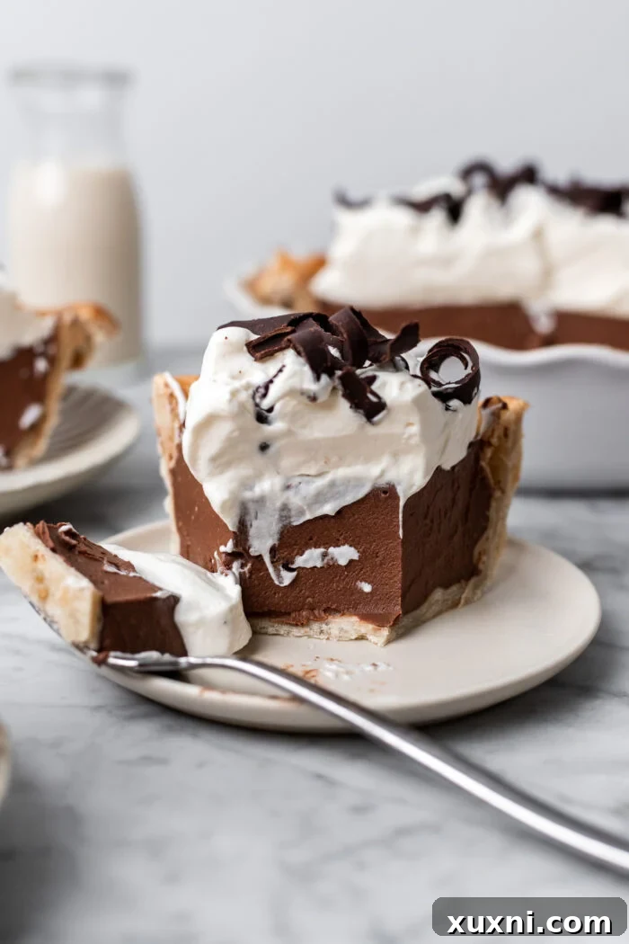 slice of vegan chocolate cream pie on a plate