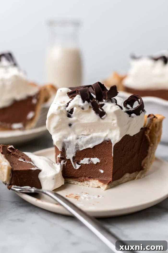 slice of vegan chocolate cream pie on a plate