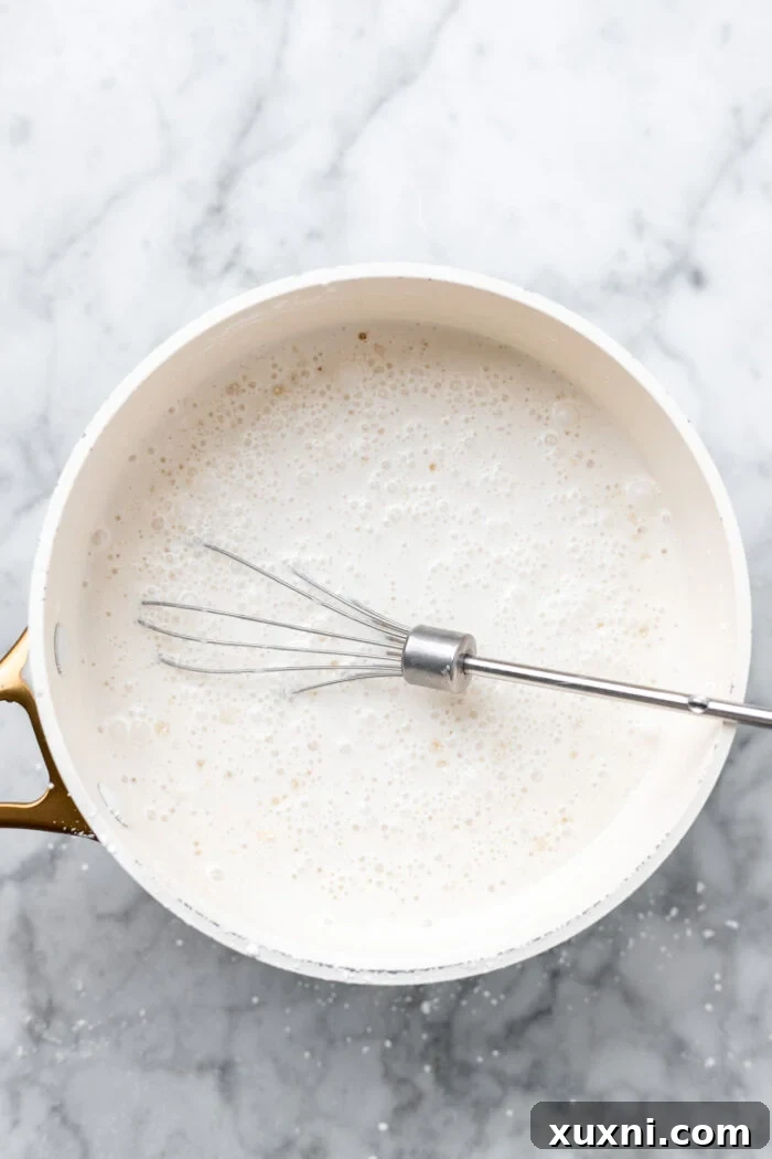 whisking together the ingredients in a pan