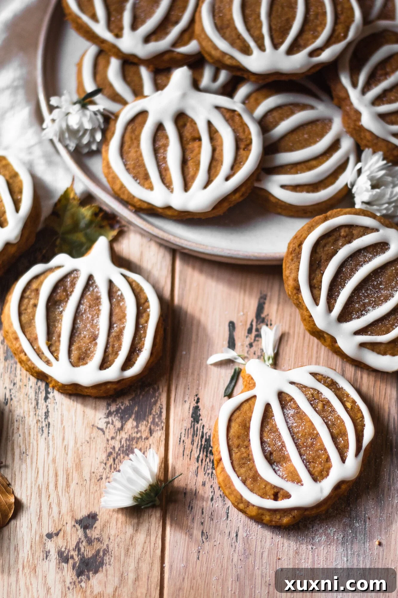 hand reaching for a vegan sugar cookie from a stack