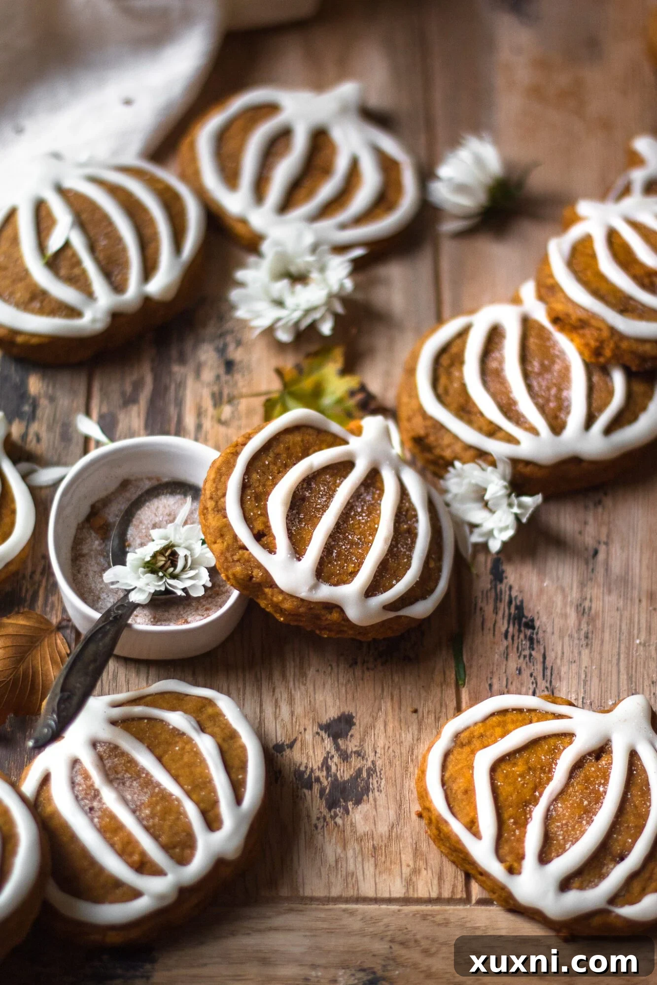 row of decorated pumpkin sugar cookies