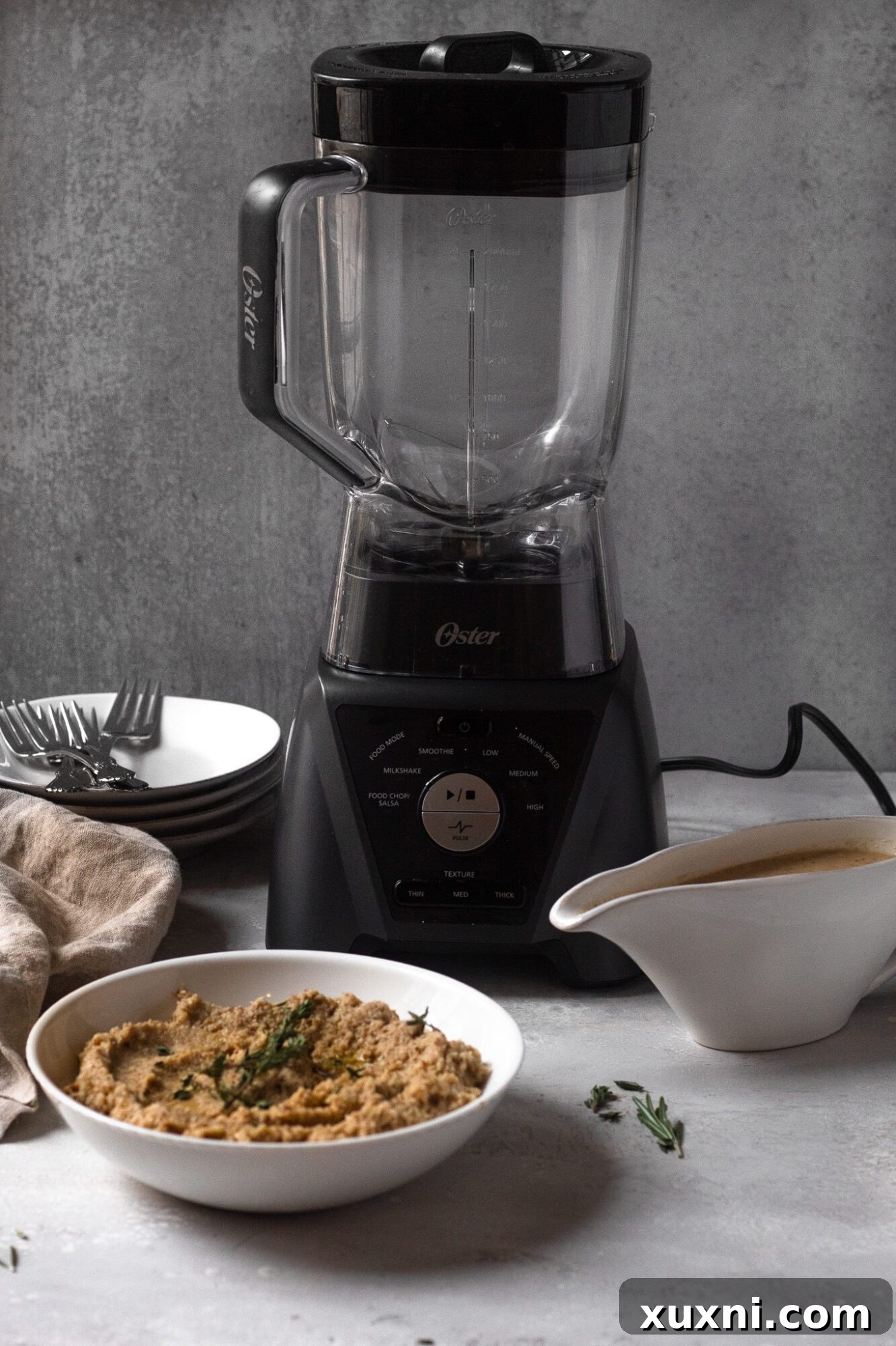 food blender with mashed cauliflower and gravy