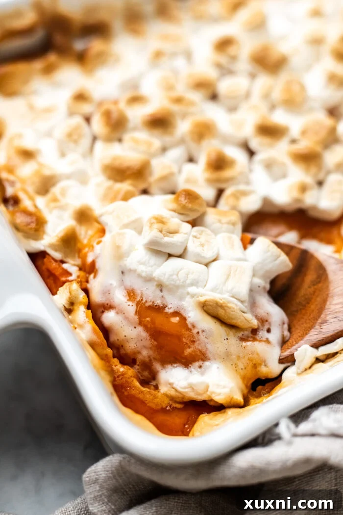 Irresistible Plant-Based Sweet Potato Casserole 8 scooping the vegan sweet potato casserole