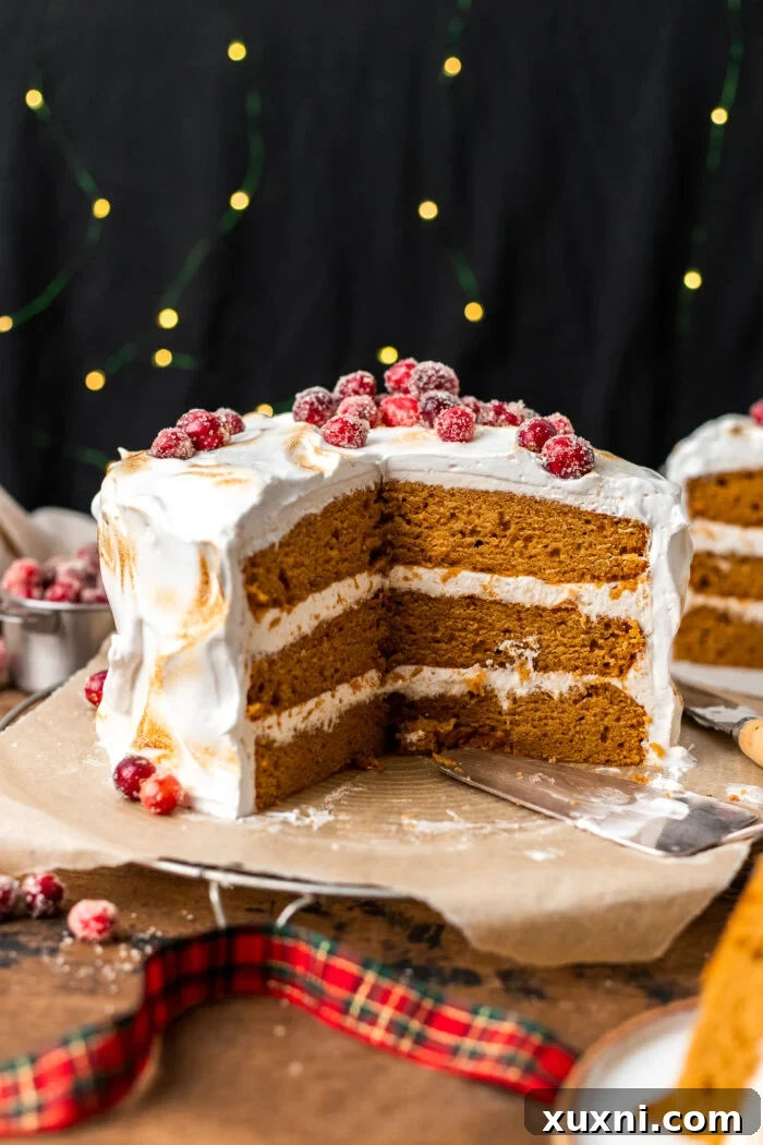 Moist, One-Bowl Vegan Sweet Potato Spice Cake with a luscious Cream Cheese Frosting, beautifully sliced to reveal its tender interior, resting on a cooling rack.